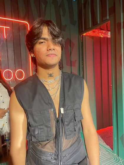 A finished look featuring a small spider painted on the neck, a subtle but edgy addition to this client's style.