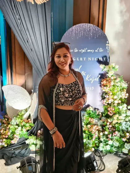 Posing by the welcome sign for a Sangeet night. It's all in the details, from the decor to the host, that makes an event feel cohesive and special.