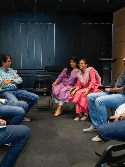 Candid moments of discussion and laughter during the Open Bench session.