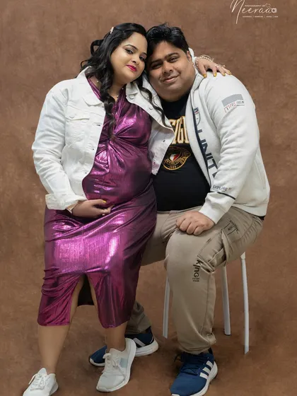 This couple chose a more modern, casual style for their studio session, and their connection shines through. The way she leans into him shows their comfort and love for each other.
