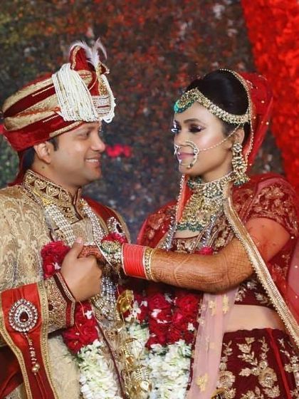 Another look at this gorgeous couple on their wedding day. The groom's coordinated sherwani complements the bride's Aarna designer label lehenga perfectly.