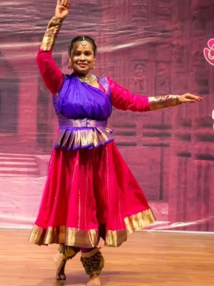 A Kathak performer in a vibrant costume, showcasing the grace and poise taught in our classes. We emphasize correct posture and fluid movements from the very beginning of the training.