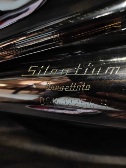 The original "Silentium" exhaust, a detail that speaks to the bike's Italian heritage.
