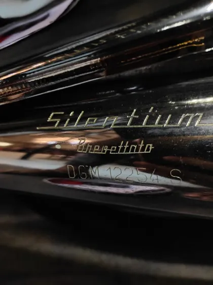 The original "Silentium" exhaust, a detail that speaks to the bike's Italian heritage.