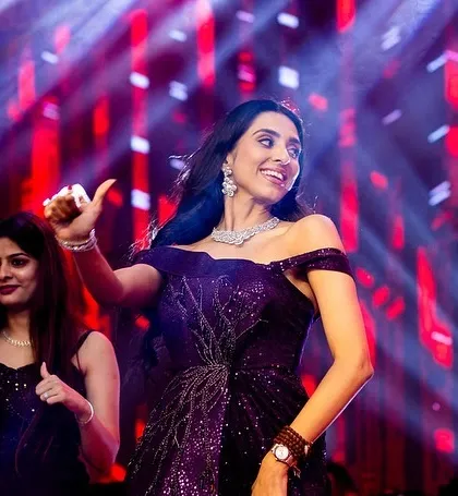 A bridesmaid giving it her all during a group performance. The energy is contagious.
