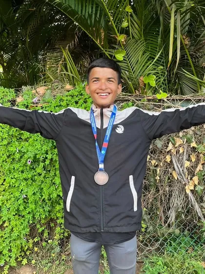A moment of pure joy for Piyush after winning his bronze medal. His open arms celebrate not just a victory, but the entire journey to get there.