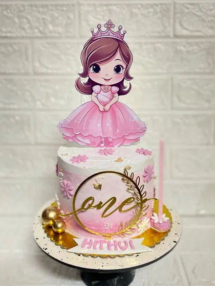 First birthdays are always special. This princess-themed chocolate truffle cake is perfect for a little one turning one, complete with a crown and gold details.
