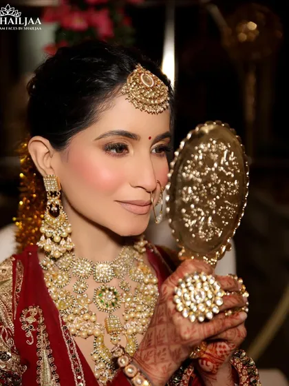 A quiet moment of reflection before the big ceremony. I created this soft, romantic bridal look with a focus on glowing skin and subtly defined eyes, ensuring the bride felt like the best version of herself.