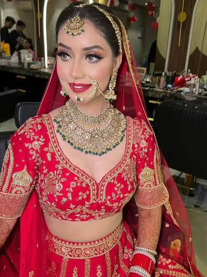 This stunning bride is wearing one of my statement bridal pieces. The layered Kundan necklace with green bead drops is paired with a matching matha patti for a complete royal look.