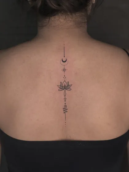 Sometimes, the most powerful statements are the most delicate. This fine-line spine tattoo is a perfect example of our minimalist work, designed to be both elegant and deeply personal, accentuating the body's natural lines.