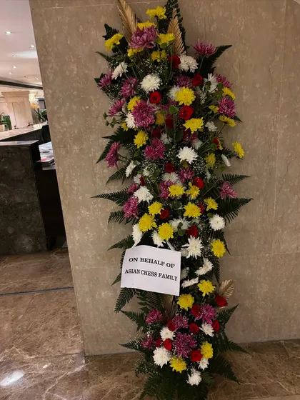 For moments that require a grand statement, I design impressive standing floral arrangements like this 6-foot tall piece. It was created for a corporate event to welcome guests with a vibrant mix of chrysanthemums, roses, and fresh ferns.