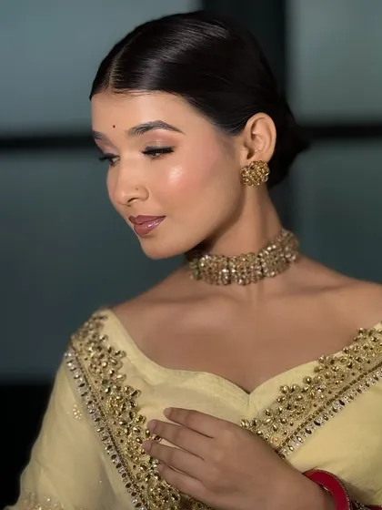 A final, elegant pose showing the beautiful, glowing skin and soft makeup. This look is all about subtlety and grace.