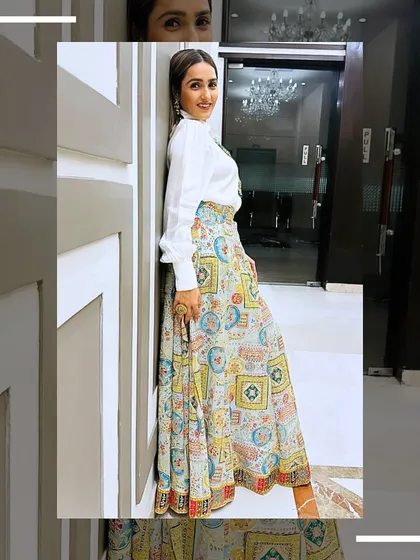 A stylish shot of me wearing the printed lehenga skirt with a classic white shirt, a perfect fusion look.