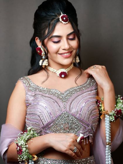 A close-up of a beautiful sangeet look. The floral jewellery and soft pink makeup create a fresh and youthful vibe.