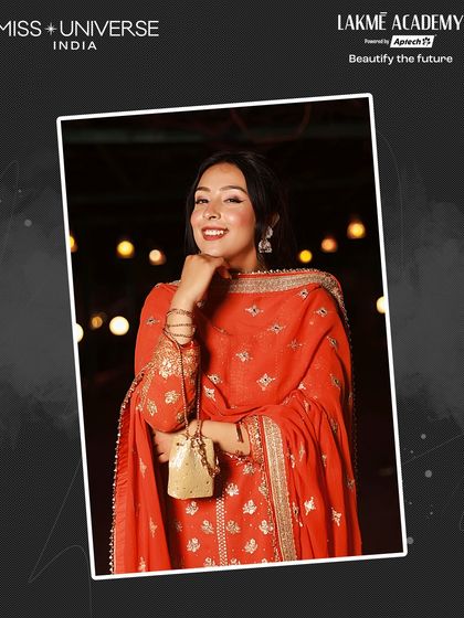 A radiant contestant in a red and gold traditional suit, with makeup that perfectly complements her outfit, created by our students for the Sufi Night.