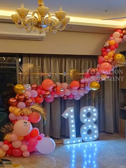 This angle shows the beautiful chandelier and how the decoration can transform an elegant indoor space. The blue floor lights add an unexpected pop of color.