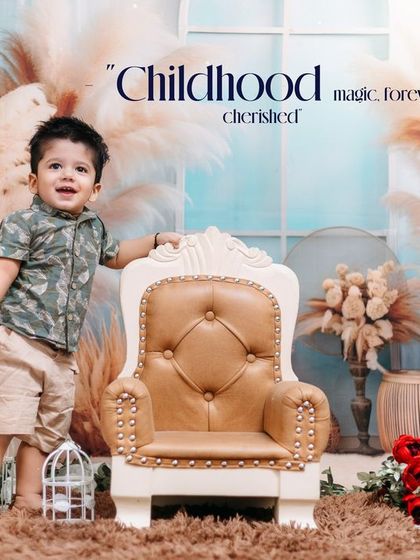 A proud toddler stands tall in our boho-themed studio for his first birthday photos. We capture these exciting new milestones, like standing and walking.
