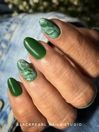 This set features a unique olive green marble design. I mixed shades of green to create a natural stone effect, paired with a solid olive green for a balanced look. It shows my versatility with color and my skill in creating detailed, nature-inspired nail art.
