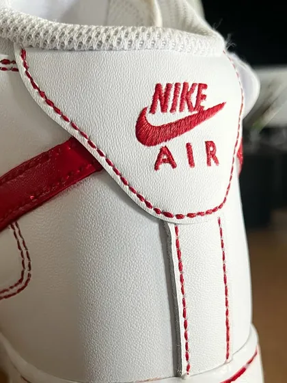 It's all in the details. This is a close-up of a custom Nike AF1 Mid where I hand-painted a delicate red stitch effect along the seams.