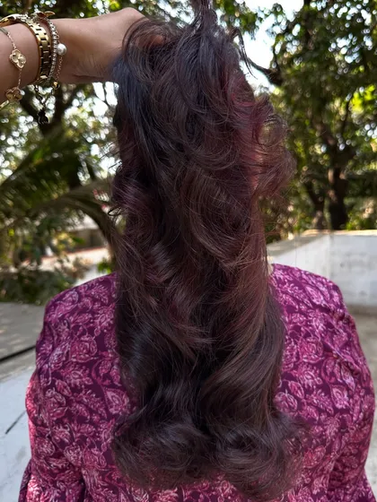 I call this creation 'Brownie + Strawberry Jam'. It's a deep brunette base with swirls of rich red, perfect for someone who wants a hint of color that's both sweet and sophisticated.