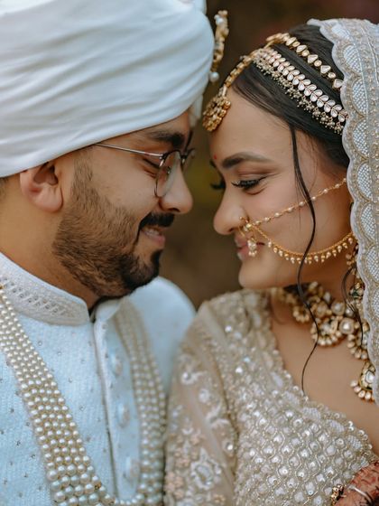 An intimate nose-to-nose portrait of the couple, capturing their deep connection and the joy of the moment.
