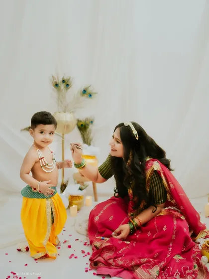 A mother's gentle touch. This tender moment captures the deep love and connection in our Maiya aur Kanha sessions.