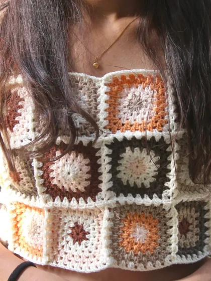 A front-on view of the granny square crop top, showcasing the pattern and the flattering square neckline.