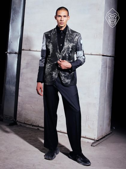 Molten Metallic: sculpted light, fluid form. This liquid-finish blazer is built to reflect power, effortlessly.