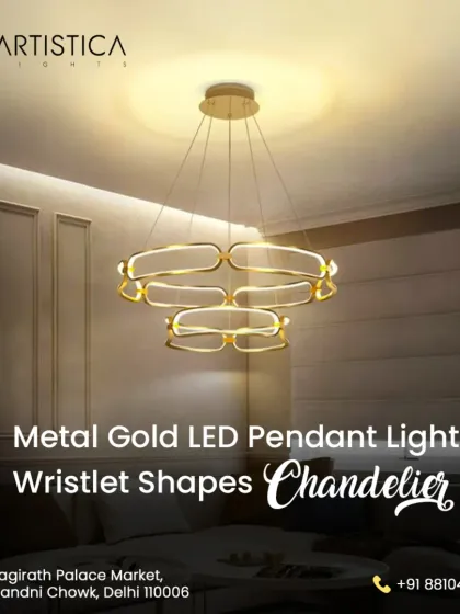 This metal gold LED pendant light features interlocking wristlet shapes, offering a modern and artistic statement. It provides a warm, ambient glow, perfect for suspension over a dining table or in a chic living area.