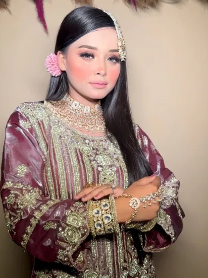 A beautiful "Chand Si Mehbooba" inspired look, with soft makeup, traditional jewelry, and a flower in the hair.