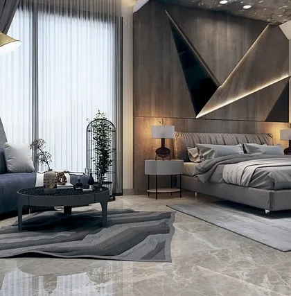 Another angle of the geometric-themed bedroom, showing a comfortable seating area by the large window.