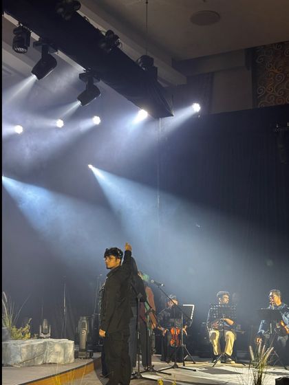 An artist on stage during the TATA Sierra launch event. Our artist management team ensures performers have everything they need for a great show.