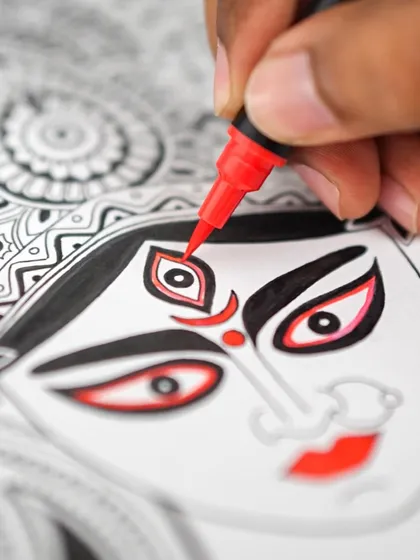 A close-up of my Durga Maa illustration, focusing on the powerful eyes. The use of red ink brings a divine energy to the intricate black and white line work.