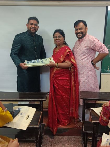 Another shot of our teachers exchanging Diwali gifts, reinforcing the family-like atmosphere at our classes.