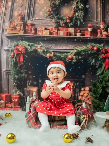 A cheeky moment with her tongue out! These playful shots show the baby's personality and the fun atmosphere of my holiday sessions.