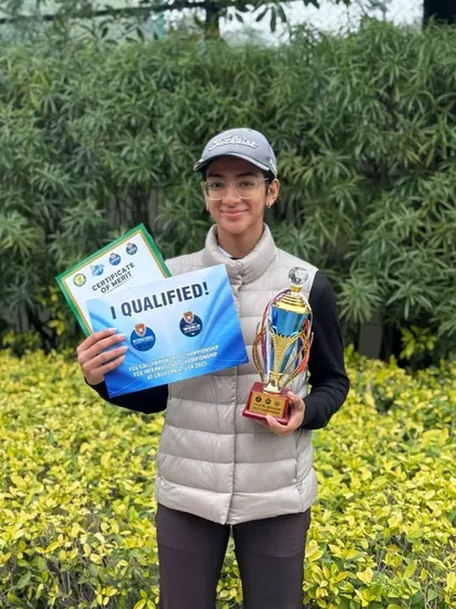 Jiyya Sharma with her Runner-up trophy and qualification certificates from the FCG & IMG Qualifier.