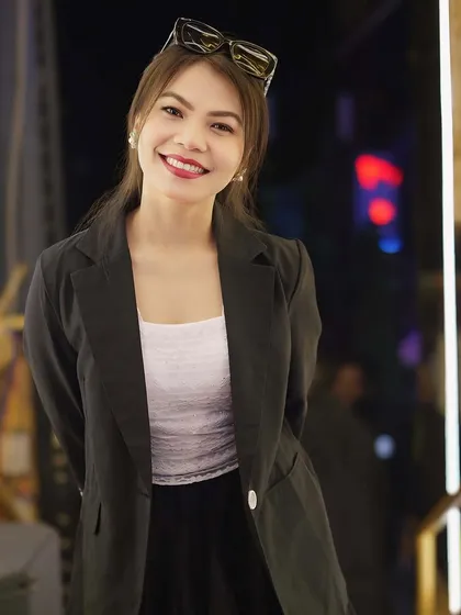 A guest with a great smile, posing for the camera.