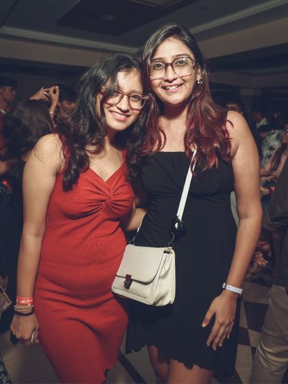 Friends posing for a photo while enjoying the party. A great DJ night is also a great social event, and I provide the perfect backdrop for it.