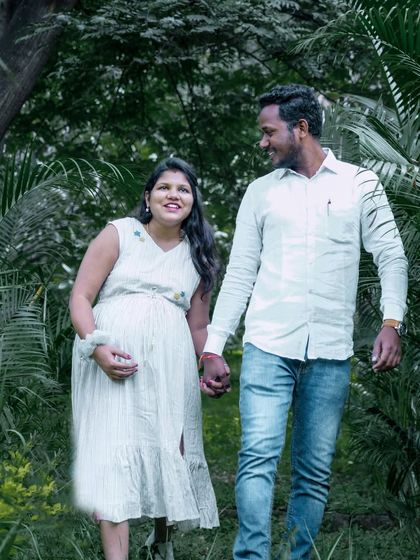 A relaxed and happy shot of a couple taking a stroll through a park. My goal is to capture your natural interactions, making the photoshoot feel like a comfortable and fun date.