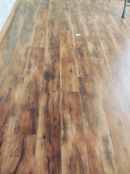 A classic wooden laminate flooring installation. This type of flooring adds warmth and value to any room and is available in many different shades and textures.