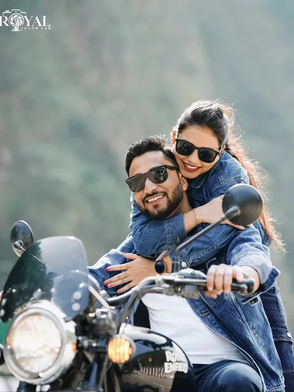 For the adventurous couple, a fun pre-wedding shot on a Royal Enfield. We love capturing your personality, whether it's quiet and romantic or bold and playful.