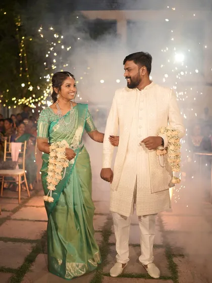 A grand entrance to mark the beginning of a new chapter. I arranged for a spectacular sparkler entrance for this couple, lighting up their path and creating a memorable, high-energy start to their wedding reception.
