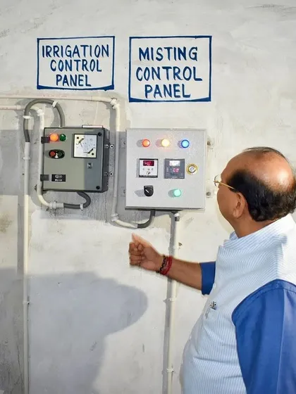 The Honourable LG of Delhi, Shri V.K. Saxena, personally inspecting the system's control panel. This central unit manages the entire misting operation, showcasing the automated and reliable nature of my pollution control solution. His involvement underscores the project's success and importance.