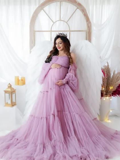For the mama who wants a true fairytale moment. This portrait features one of my ethereal tulle gowns and majestic angel wings, creating a breathtaking and magical pregnancy photo.
