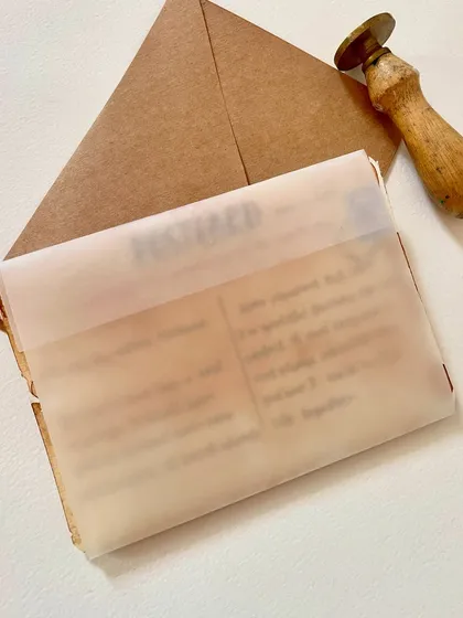 To protect the delicate details, I wrap each postcard in this translucent paper before it goes into the envelope. It adds another layer to the unboxing experience.