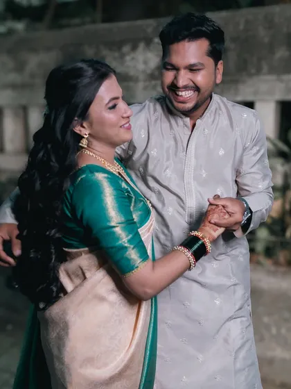 The couple shares a dance and a laugh during their celebration.
