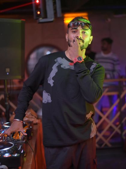 A thoughtful moment mid-set. It's a constant process of reading the room and deciding where to take the musical journey next.