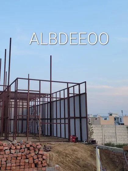 The initial stages of a double-story porta cabin building in Meerut. You can see the decking sheet laid for the first floor and the MS frame for the walls going up.
