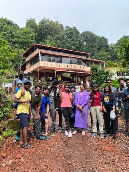 A group photo in front of our homestay at Kodachadri, ready for the day's adventure.