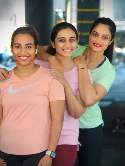 A close-up with my clients. The smiles show the strong bond we build while working towards our fitness goals together.